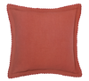 persimmon pillow photographed on white background