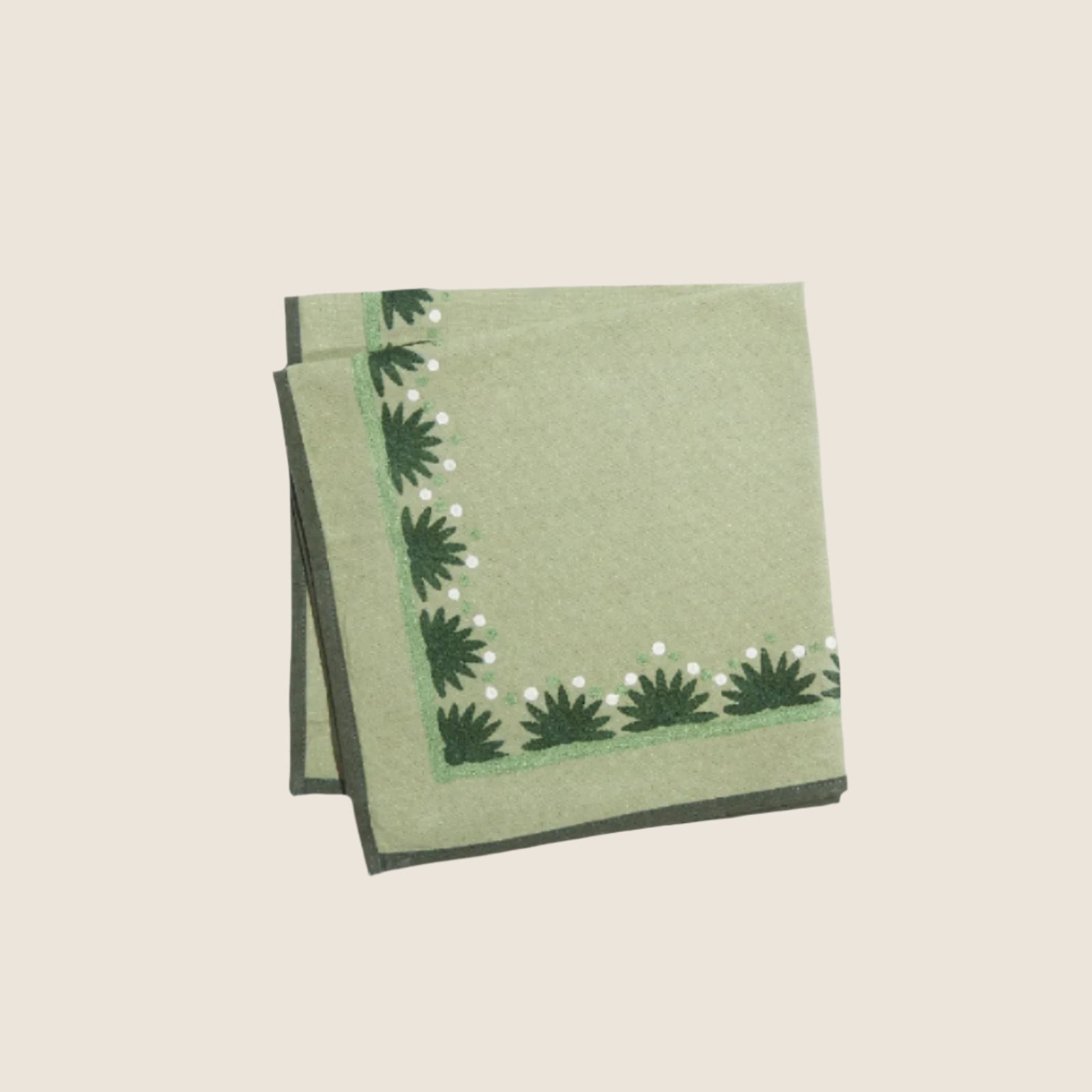 starburst evergreen napkin on a white background