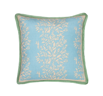 primrose azul pillow with contrasting green trim photographed against a white background