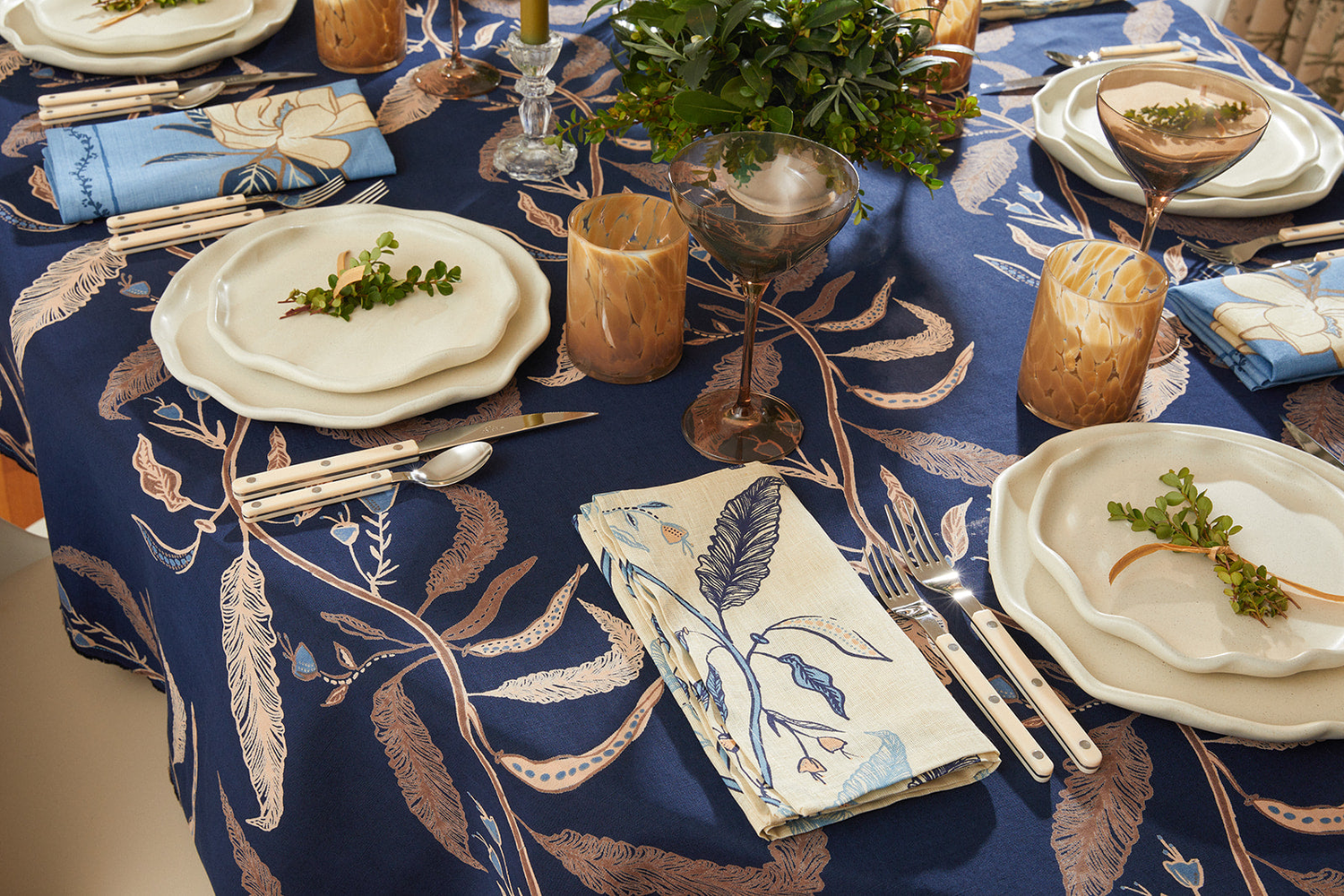 holly vine tablcloth overhead photo of table with place setting and flowers