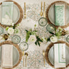 hollyvine green and blue tablecloth with place settings and bud vases